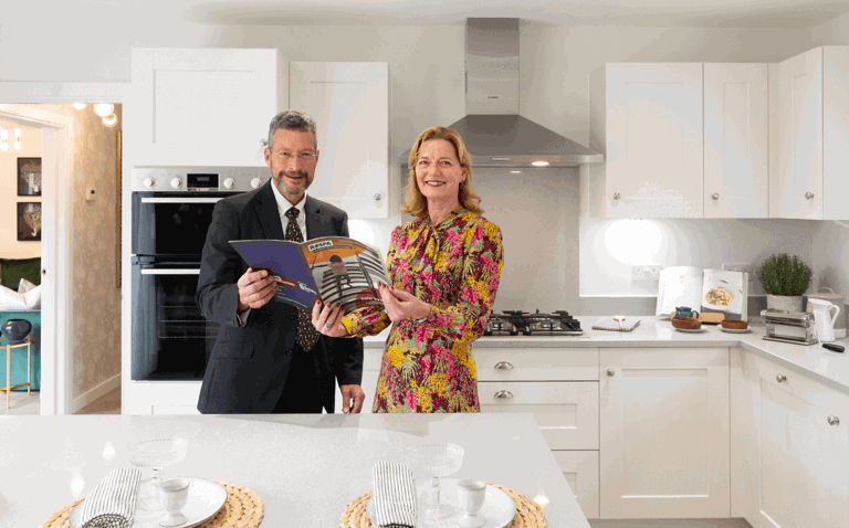 Man and lady standing in a kitchen