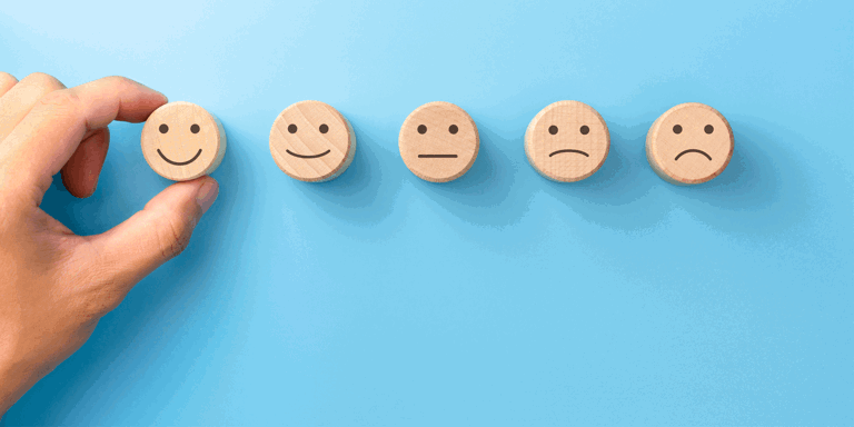 wooden happy and sad faces