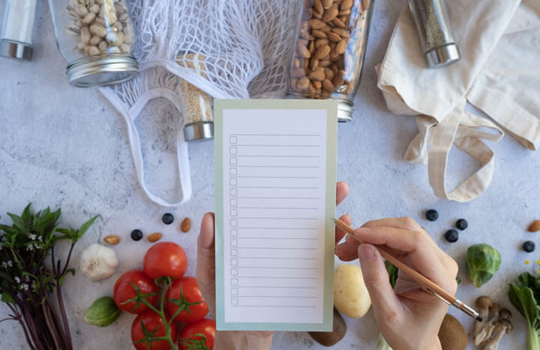 hand writing a shopping list