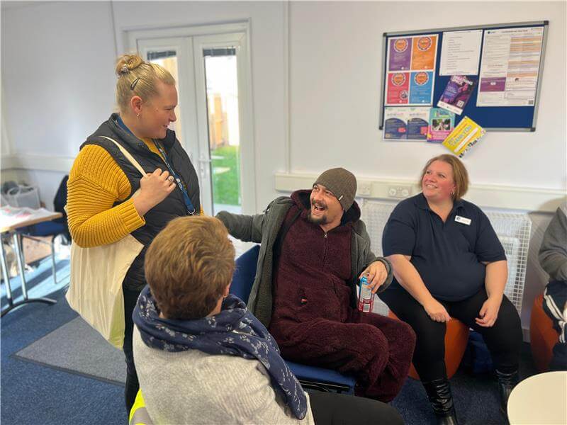 Photo of people talking at a community event